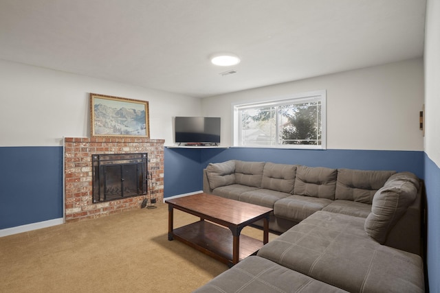 living area with visible vents, carpet flooring, a fireplace, and baseboards