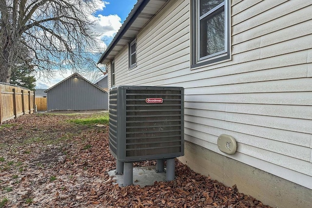 details with central AC unit and fence