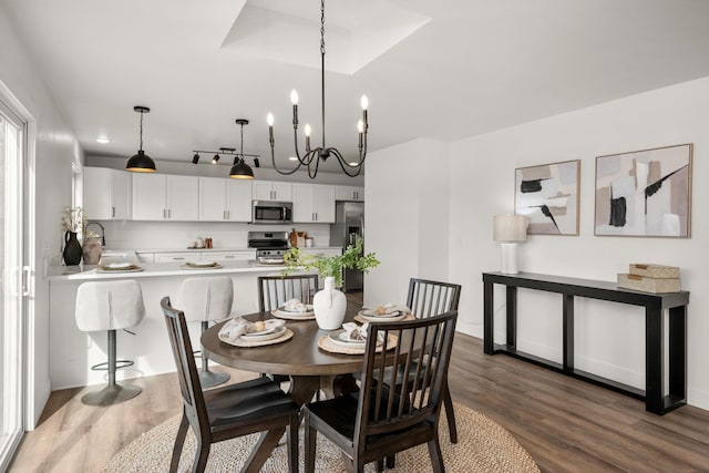 6712 C Highway 291, Nine Mile Falls, WA 99026 - dining area featuring dark wood-type flooring and a chandelier