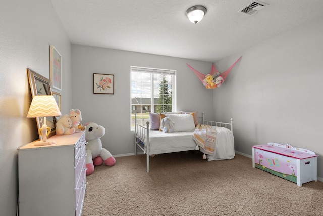 bedroom featuring visible vents, baseboards, and carpet flooring