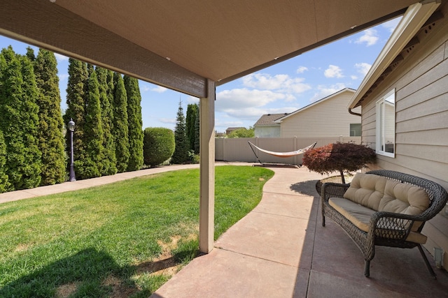 view of patio / terrace featuring fence