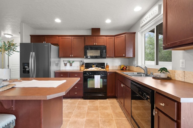 kitchen with black appliances, a sink, a textured ceiling, recessed lighting, and light tile patterned floors