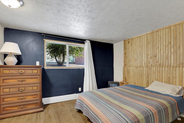 12017 E Mansfield Avenue ., Spokane Valley, WA 99206 - bedroom featuring wood finished floors, baseboards, and a textured ceiling