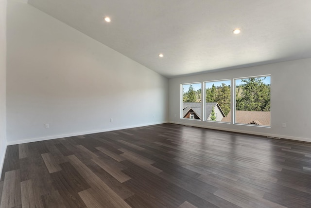 806 W Bolan Ave, Spokane, WA 99224 - unfurnished room with dark wood-type flooring, lofted ceiling, recessed lighting, and baseboards