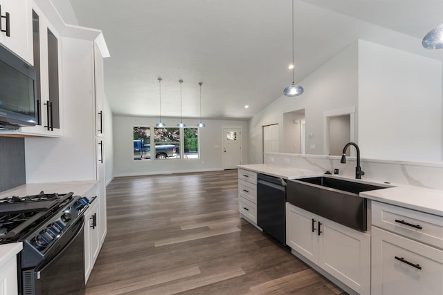 806 W Bolan Ave, Spokane, WA 99224 - kitchen featuring black appliances, a sink, vaulted ceiling, white cabinetry, and hanging light fixtures