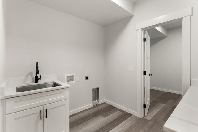 806 W Bolan Ave, Spokane, WA 99224 - laundry room featuring dark wood-style flooring, hookup for an electric dryer, cabinet space, washer hookup, and baseboards