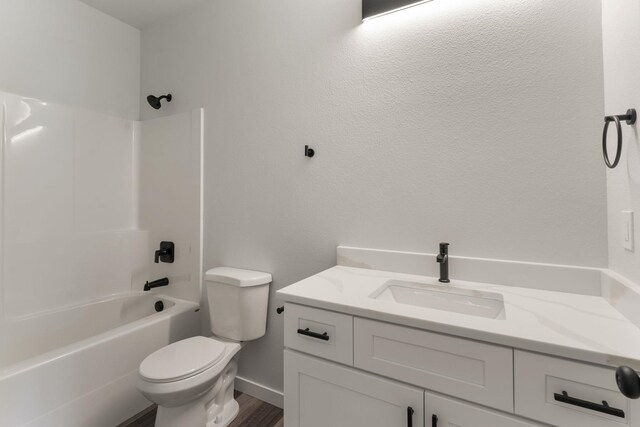 806 W Bolan Ave, Spokane, WA 99224 - full bathroom with toilet, vanity, bathtub / shower combination, wood finished floors, and baseboards