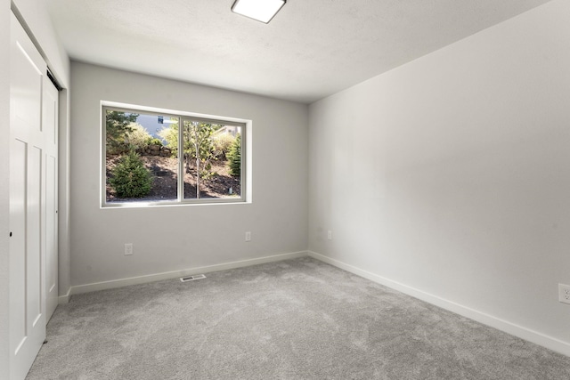 806 W Bolan Ave, Spokane, WA 99224 - unfurnished bedroom with carpet, baseboards, and a closet