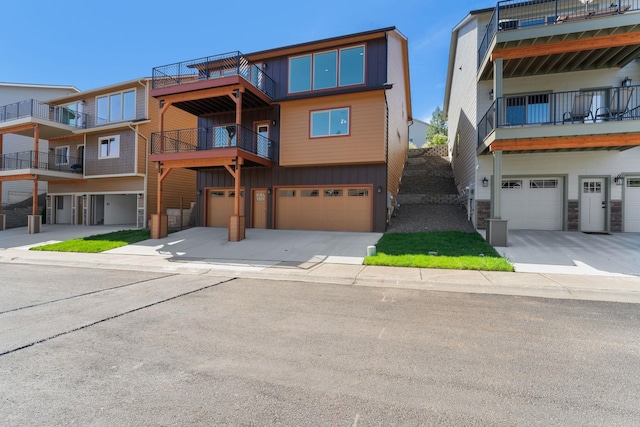 806 W Bolan Ave, Spokane, WA 99224 - view of front facade with a garage, driveway, and board and batten siding