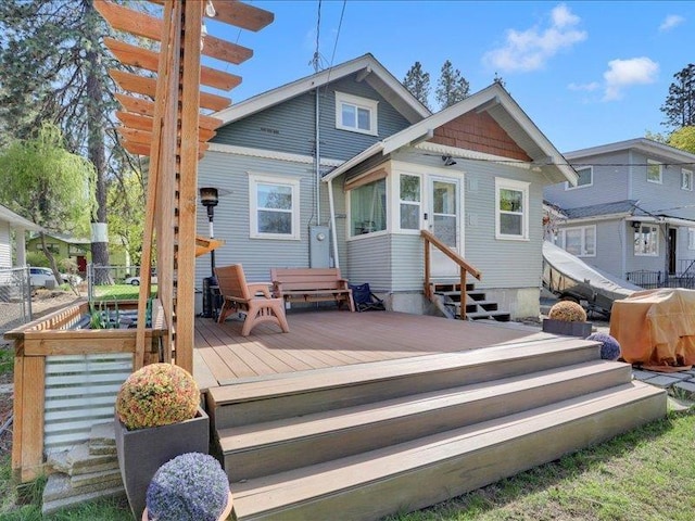 back of house with entry steps and a wooden deck