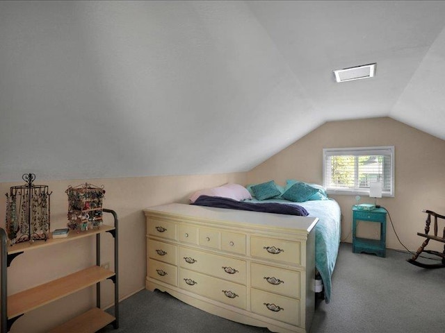 bedroom with carpet flooring and lofted ceiling