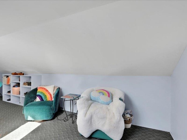 playroom featuring carpet and lofted ceiling