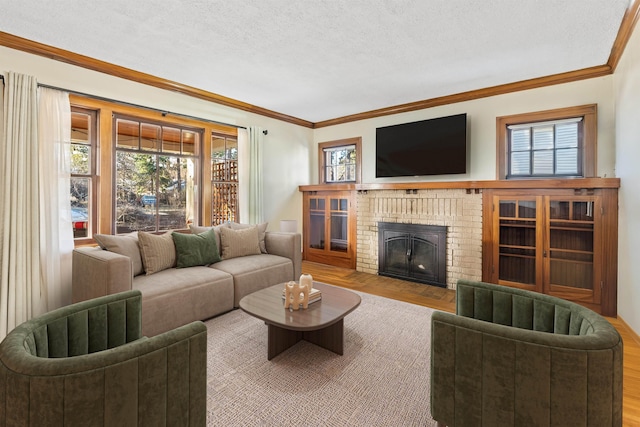 living area featuring a textured ceiling, crown molding, and a brick fireplace