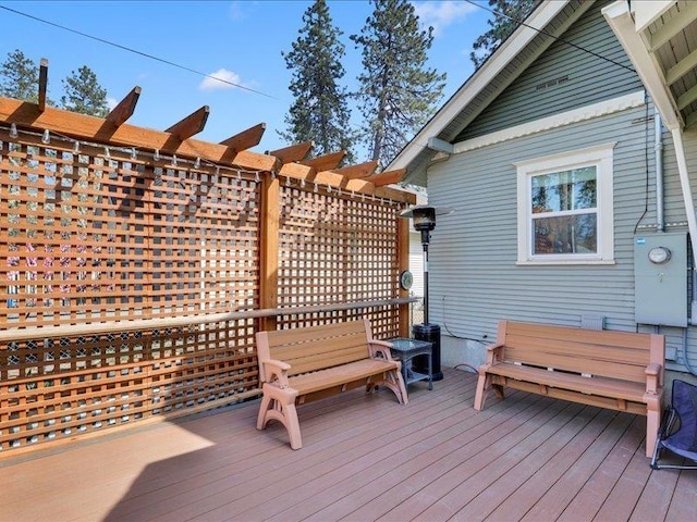wooden terrace with a pergola