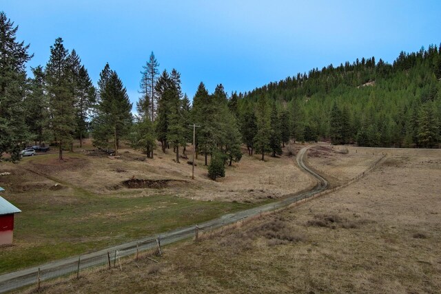 2063-A Marble Valley Basin Rd, Addy, WA 99101 - view of wooded area with a view of rural / pastoral area