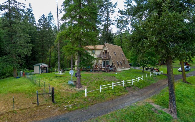 2063-A Marble Valley Basin Rd, Addy, WA 99101 - a-frame home featuring a wooden deck, a gambrel roof, and roof with shingles