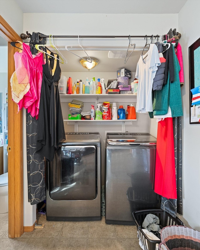 laundry room featuring washer and dryer, tile patterned flooring, and laundry area