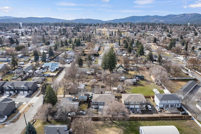 drone / aerial view featuring a residential view and a mountain view