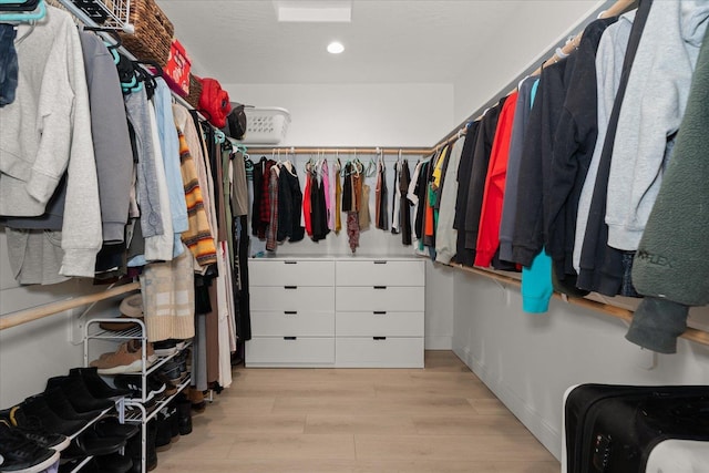 spacious closet featuring light wood-type flooring