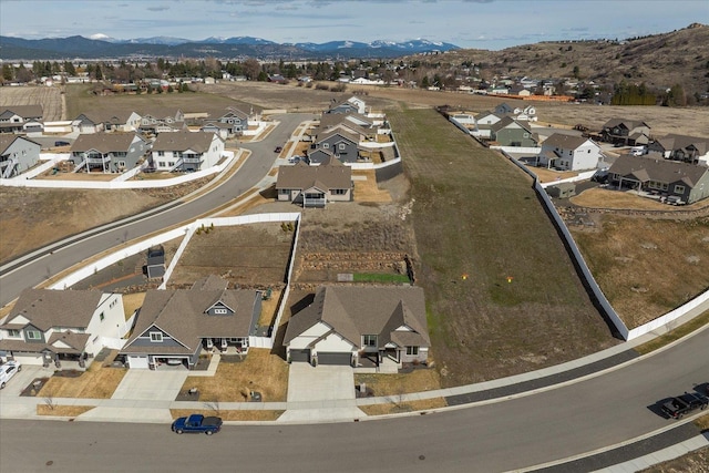 birds eye view of property with a residential view and a mountain view
