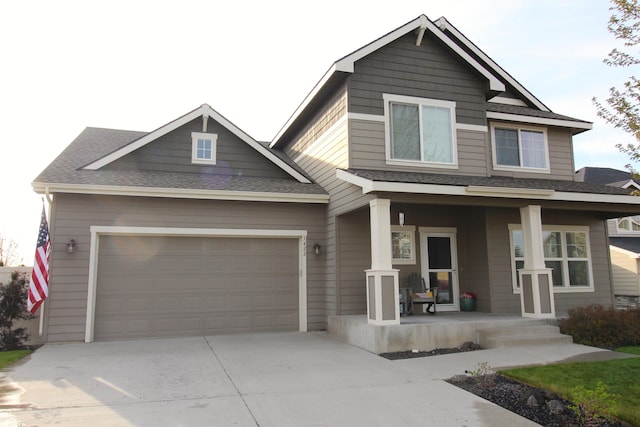 5422 S Ravencrest Cir, Spokane, WA 99224 - craftsman-style house featuring a porch, concrete driveway, and roof with shingles