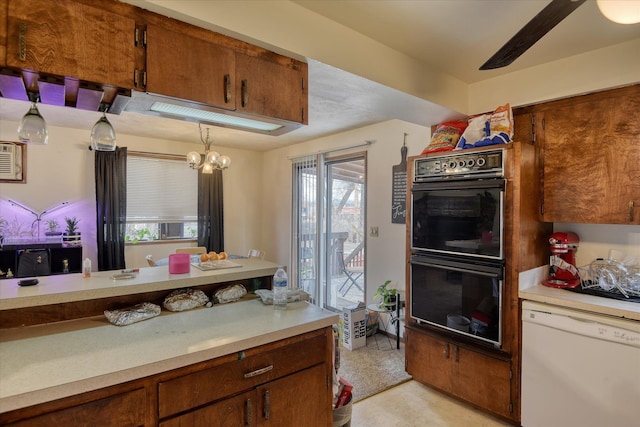 6208 N Wiscomb St, Spokane, WA 99208 - kitchen featuring white dishwasher, light countertops, brown cabinets, a chandelier, and light flooring