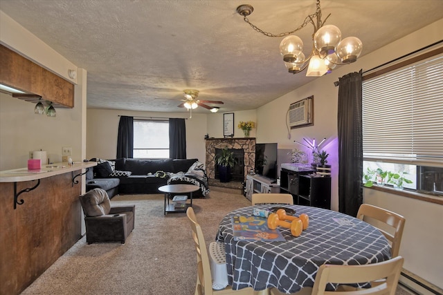 6208 N Wiscomb St, Spokane, WA 99208 - carpeted dining space featuring a chandelier, a ceiling fan, a baseboard radiator, a stone fireplace, and a wall unit AC