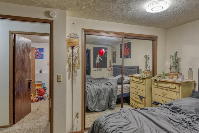 6208 N Wiscomb St, Spokane, WA 99208 - carpeted bedroom with a closet and a textured ceiling