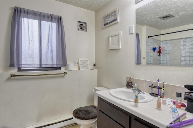 6208 N Wiscomb St, Spokane, WA 99208 - full bathroom with a textured ceiling, a baseboard heating unit, vanity, a shower, and tasteful backsplash