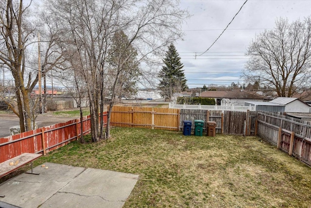 6208 N Wiscomb St, Spokane, WA 99208 - fenced backyard featuring a patio area
