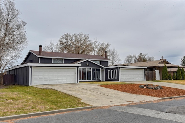 6208 N Wiscomb St, Spokane, WA 99208 - mid-century home with driveway, a garage, board and batten siding, and a front yard