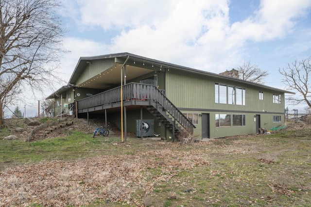 313 SE Trinity Ave, Wilbur, WA 99185 - back of house with stairs, a deck, a cooling unit, and a chimney