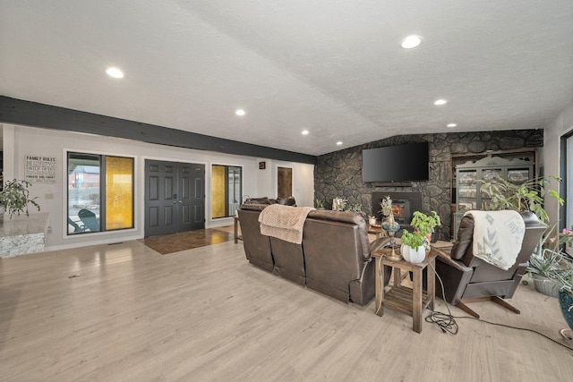 313 SE Trinity Ave, Wilbur, WA 99185 - cinema with wood finished floors, a stone fireplace, recessed lighting, and vaulted ceiling