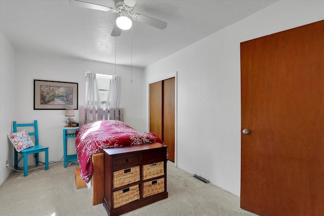 870 E 8th Ave, Colville, WA 99114 - bedroom featuring a closet, visible vents, light colored carpet, and a ceiling fan