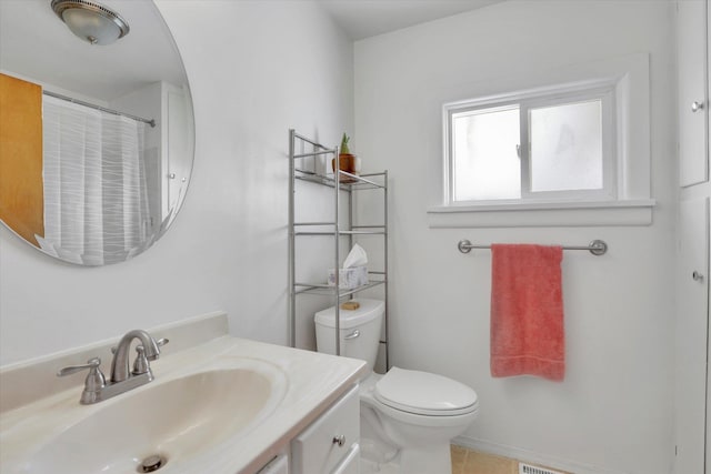 870 E 8th Ave, Colville, WA 99114 - full bath with tile patterned flooring, vanity, a shower with curtain, and toilet