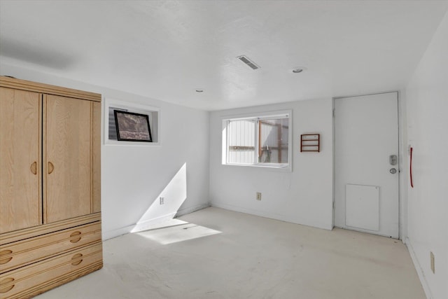 870 E 8th Ave, Colville, WA 99114 - unfurnished bedroom featuring concrete flooring, visible vents, and baseboards
