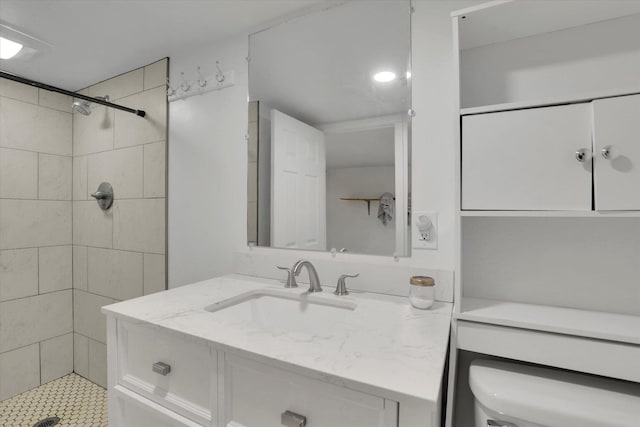 870 E 8th Ave, Colville, WA 99114 - bathroom with vanity, a tile shower, and toilet