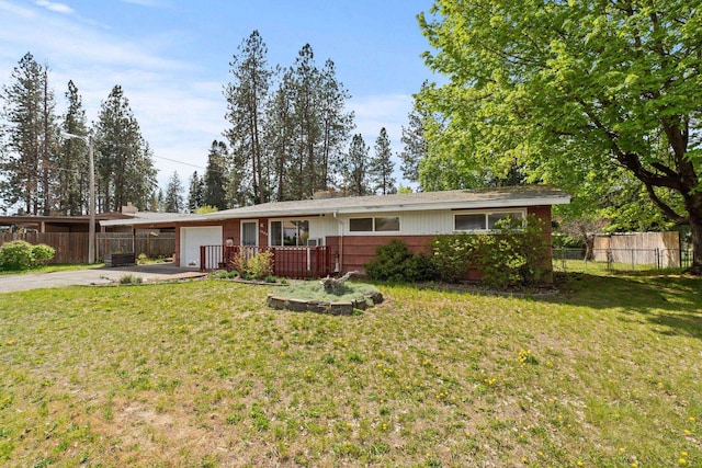 1804 S Blake Rd, Spokane Valley, WA 99216 - ranch-style house with fence, an attached garage, concrete driveway, and a front lawn