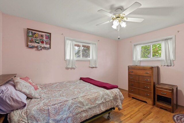 1804 S Blake Rd, Spokane Valley, WA 99216 - bedroom featuring multiple windows, a ceiling fan, and light wood-type flooring