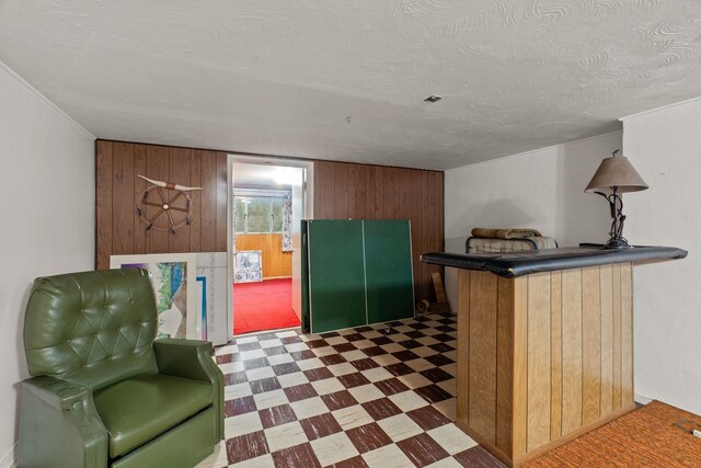 1804 S Blake Rd, Spokane Valley, WA 99216 - bar featuring tile patterned floors, wood walls, and a textured ceiling