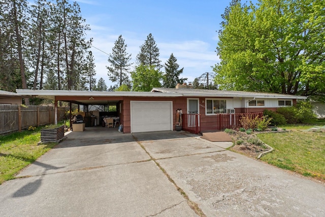 1804 S Blake Rd, Spokane Valley, WA 99216 - ranch-style home with a front yard, a carport, fence, concrete driveway, and an attached garage