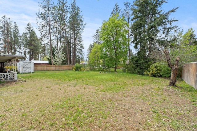 1804 S Blake Rd, Spokane Valley, WA 99216 - view of yard featuring an outbuilding, a fenced backyard, and a shed