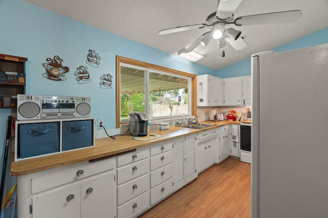 1804 S Blake Rd, Spokane Valley, WA 99216 - kitchen with freestanding refrigerator, ceiling fan, white cabinets, a sink, and range