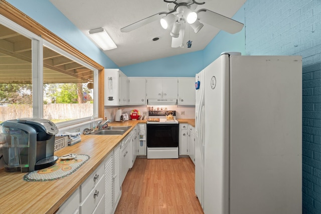 1804 S Blake Rd, Spokane Valley, WA 99216 - kitchen featuring lofted ceiling, range with electric stovetop, light countertops, a sink, and white fridge with ice dispenser