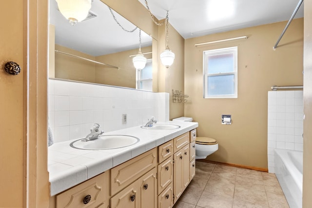 147 N Lindsey St, Tekoa, WA 99033 - full bath featuring tile patterned floors, a sink, toilet, and decorative backsplash