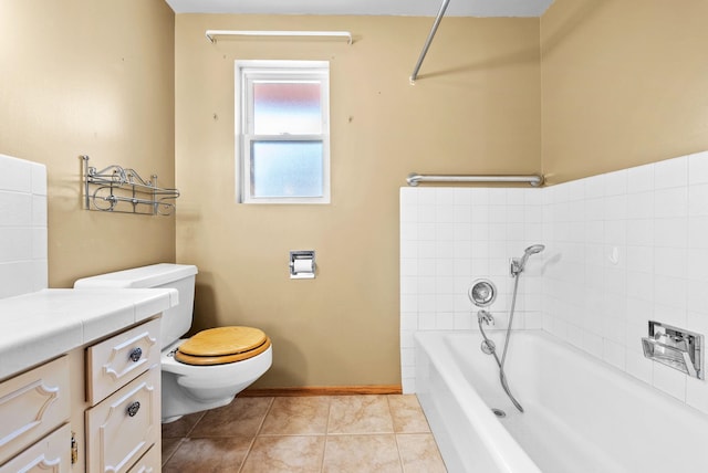 147 N Lindsey St, Tekoa, WA 99033 - bathroom featuring toilet, vanity, tile patterned flooring, a bath, and baseboards