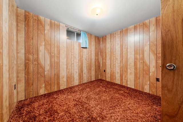147 N Lindsey St, Tekoa, WA 99033 - spare room with wood walls and carpet flooring