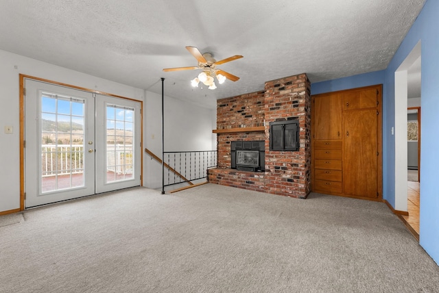 147 N Lindsey St, Tekoa, WA 99033 - unfurnished living room with carpet flooring, french doors, a ceiling fan, a textured ceiling, and baseboards