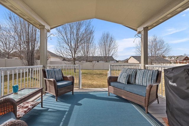 deck with a fenced backyard, a yard, outdoor lounge area, and a residential view