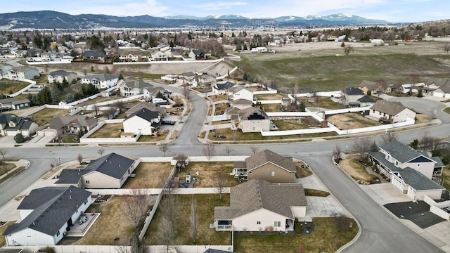 drone / aerial view with a residential view and a mountain view